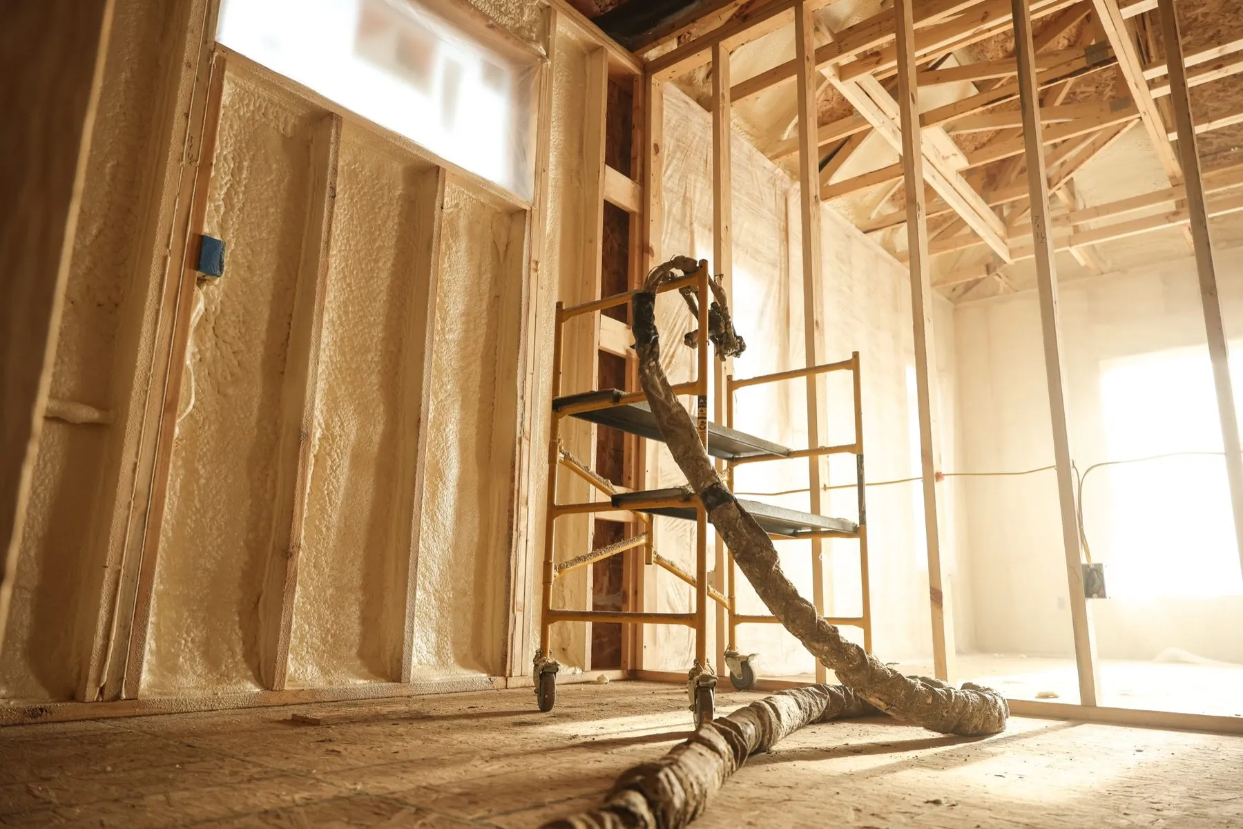 Metal building insulated with spray foam